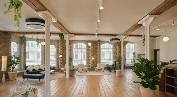 menier venues event space showing big windows, wooden floor and decorative plants