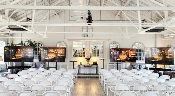 Lumiere venue space with chairs and screens